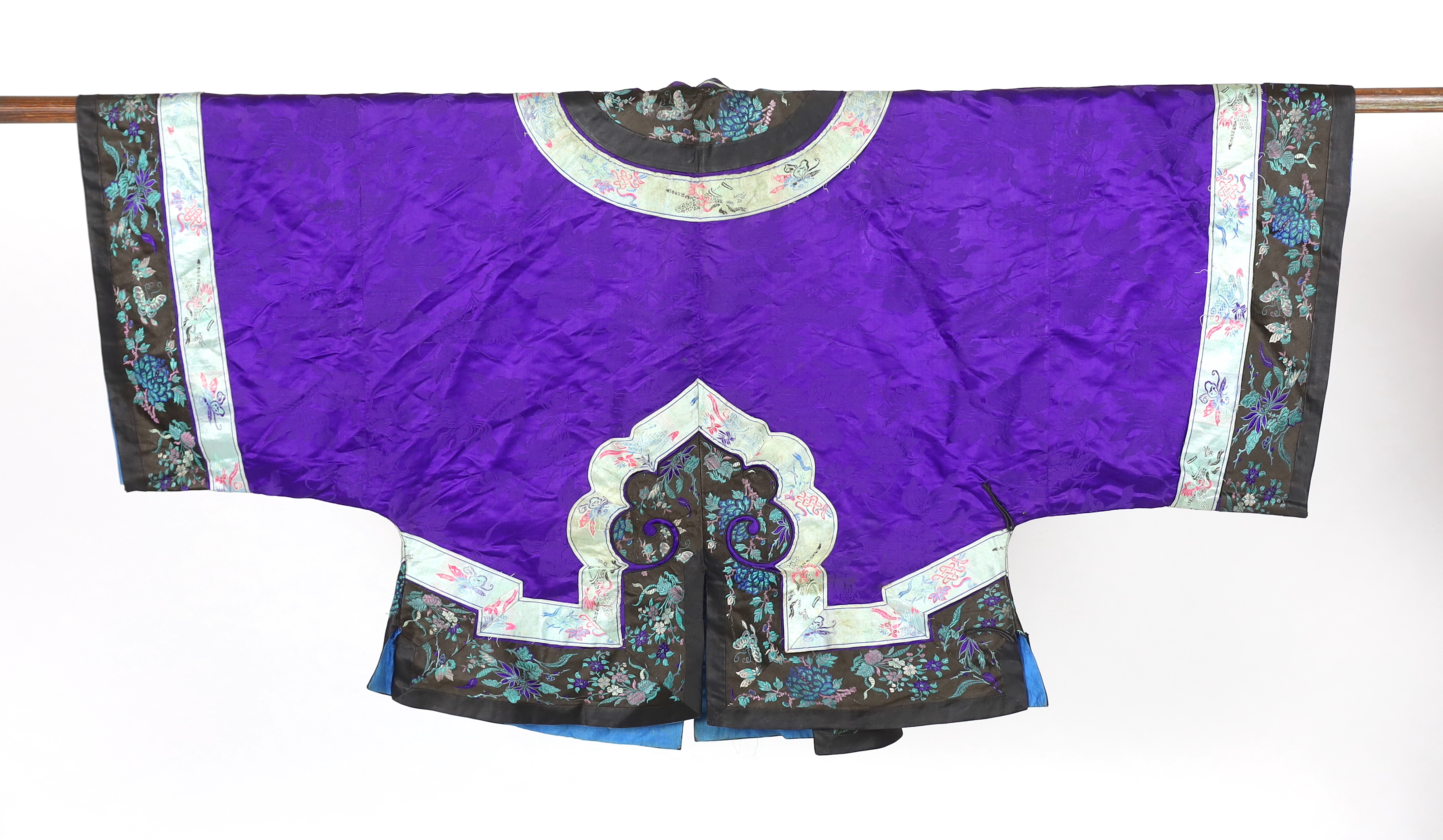 A Chinese purple damask jacket, circa late 19th / early 20th century, decorated with black and turquoise embroidered braiding with auspicious symbols, butterflies and flowers embroidery, 63cm long